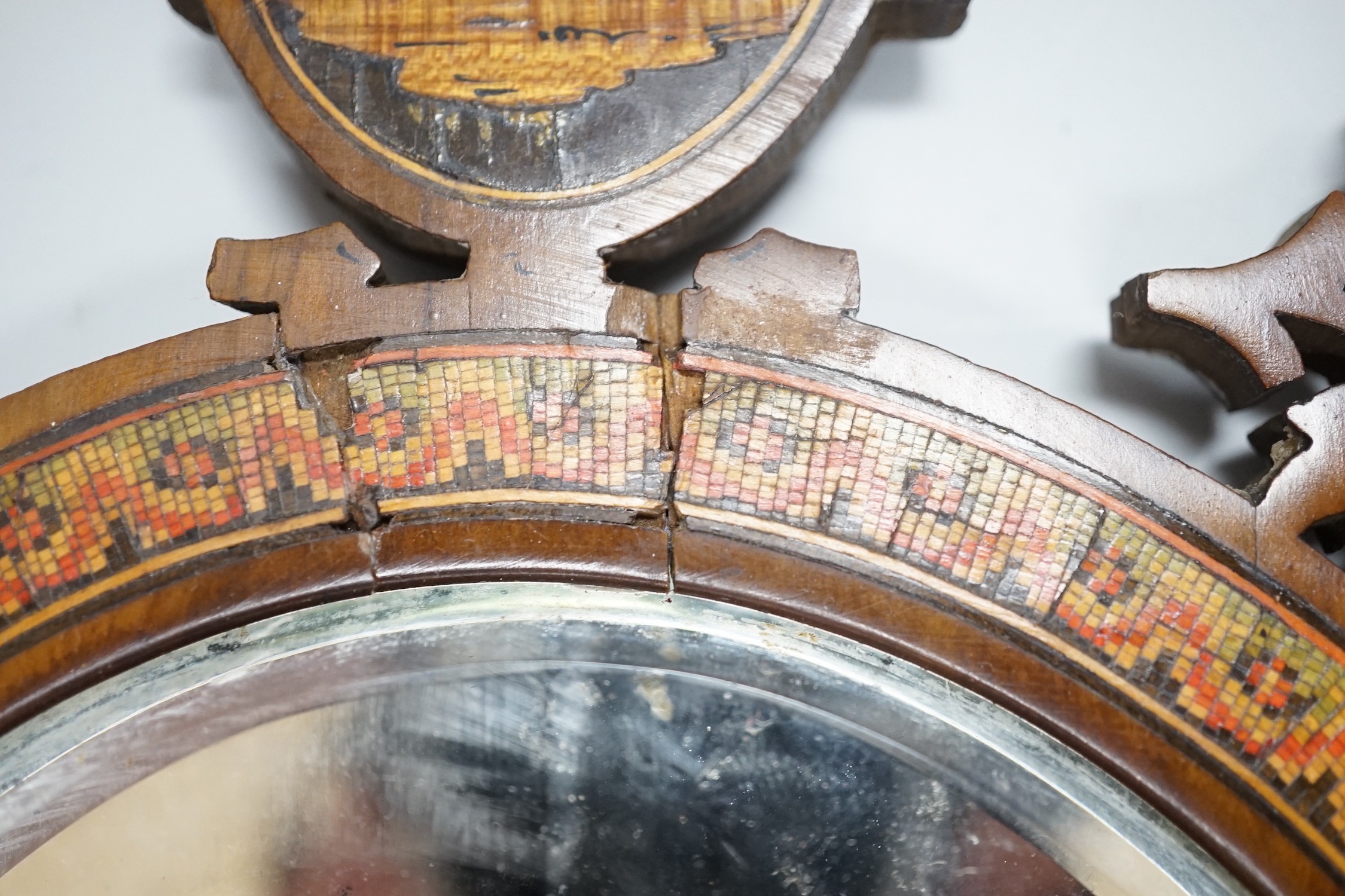 A 19th century fretted olivewood Sorrento ware toilet mirror, 45cm long